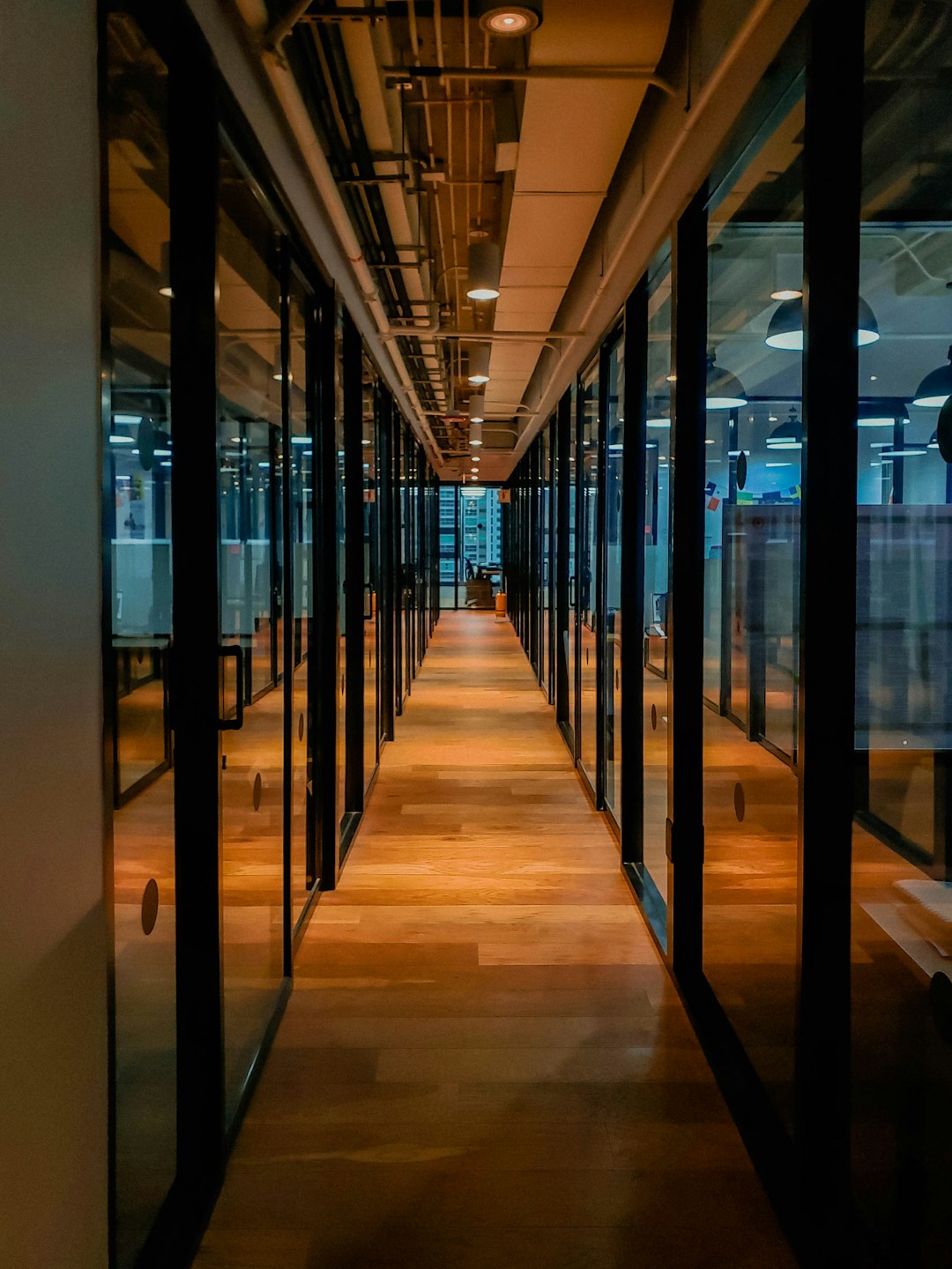 glass-paneled-long-wooden-floored-hallway-c3tniab098i